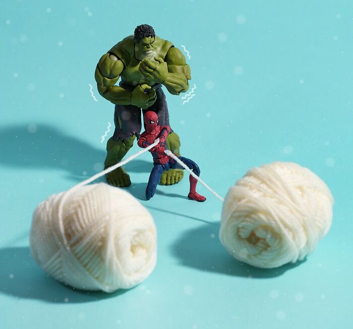 Miniature Calendar work by Tatsuya Tanaka: Hulk and Spider-Man playing with yarn on a blue background.