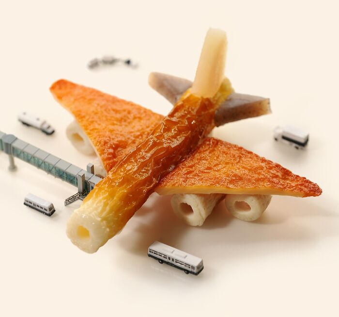 Miniature Calendar work by Tatsuya Tanaka showing a plane crafted from food items at a tiny airport.