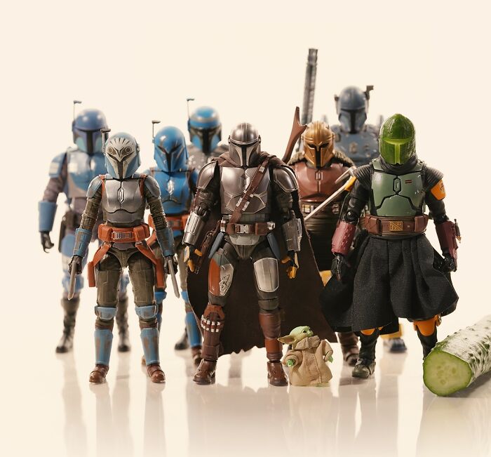 A Tatsuya Tanaka miniature calendar creation displays various Mandalorian action figures and Grogu beside a cucumber slice.