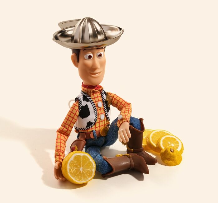 Miniature Calendar work by Tatsuya Tanaka where Woody from Toy Story wears a lemon juicer as a hat.