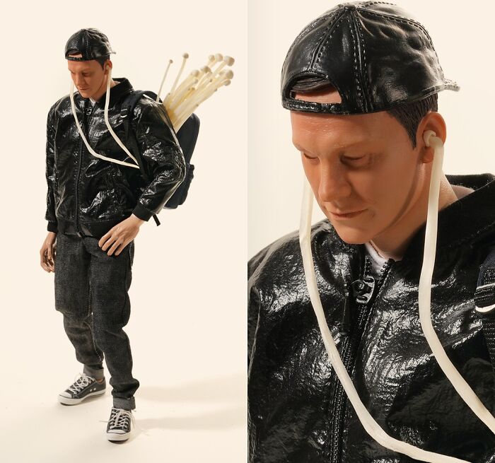 Miniature Calendar work by Tatsuya Tanaka with a miniature figure carrying mushrooms as a backpack, using headphones.