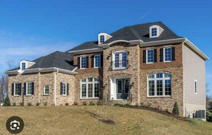 Stately brick mansion with a multi-level design, a true architectural inspiration, inspiring Temu versions.