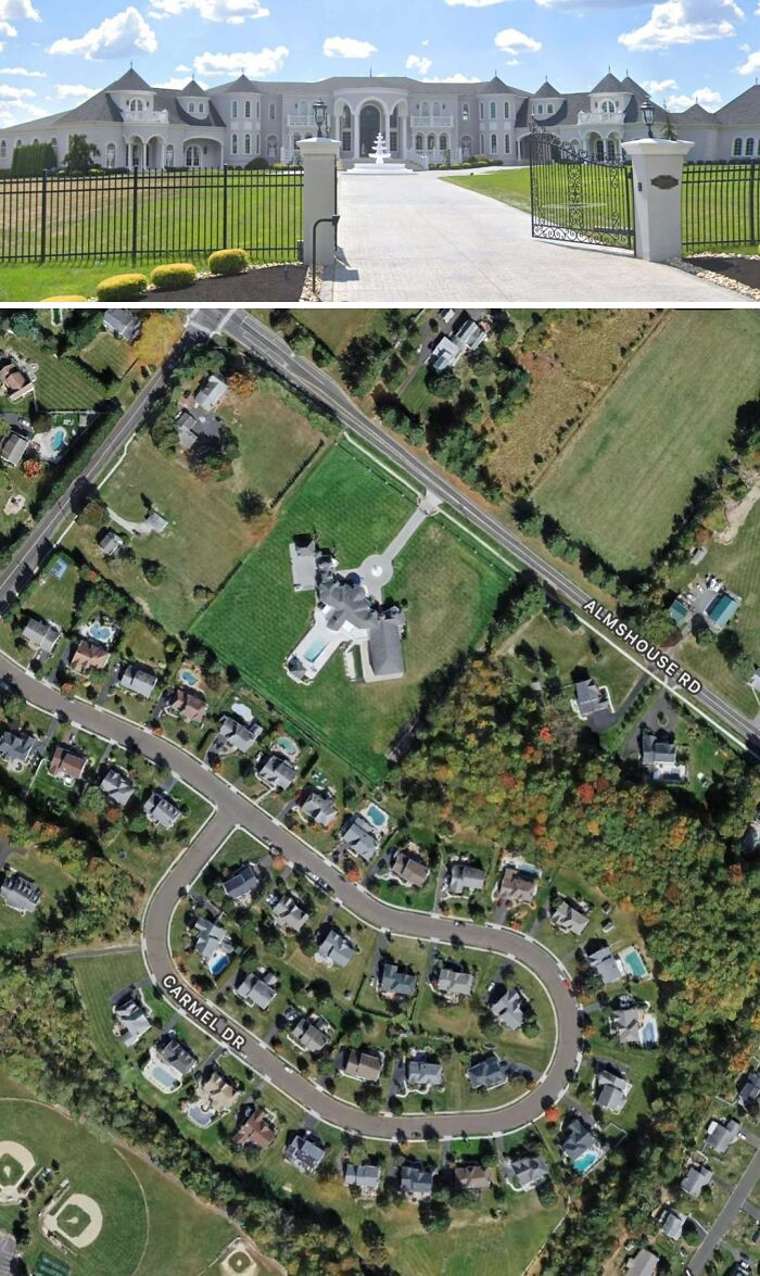 An aerial view of a large mansion with a long driveway, showcasing its grand scale.
