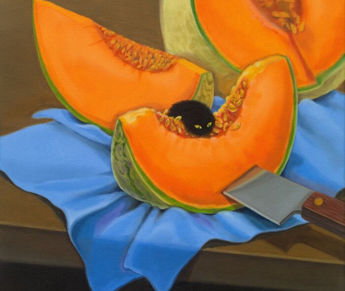 A black cat peeking from a cantaloupe slice on a blue cloth with a knife, showcasing a surreal moment.