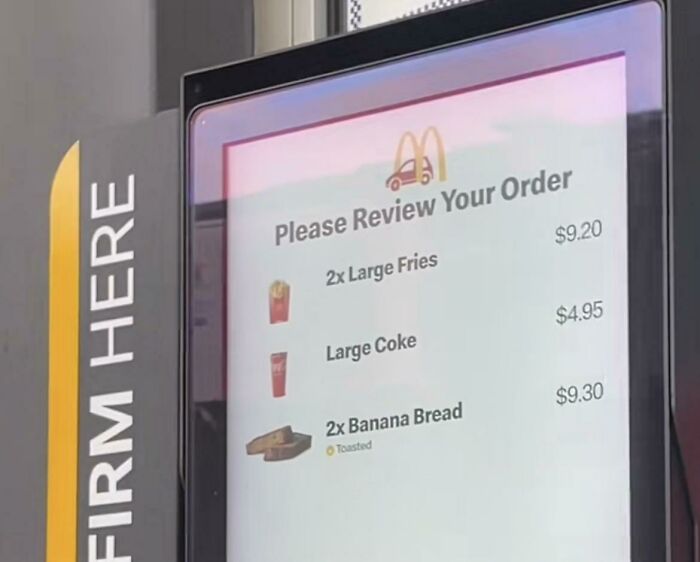 A McDonald's drive-thru screen showing an order for large fries, large coke, and banana bread, a sad world we're living in.