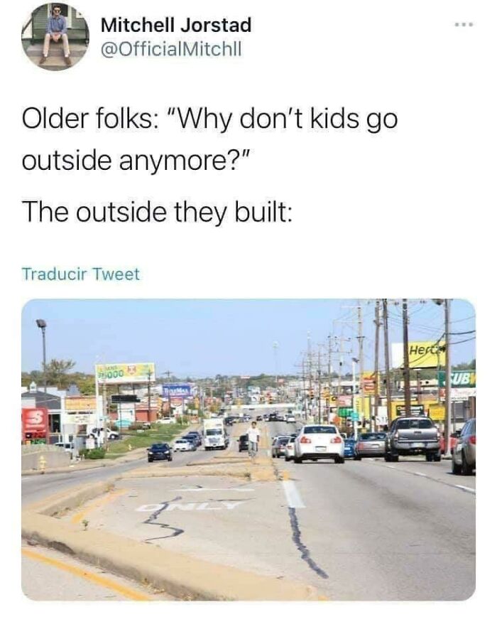 A meme shows a tweet about the sad world we're living in, featuring a photo of a desolate, car-filled street.