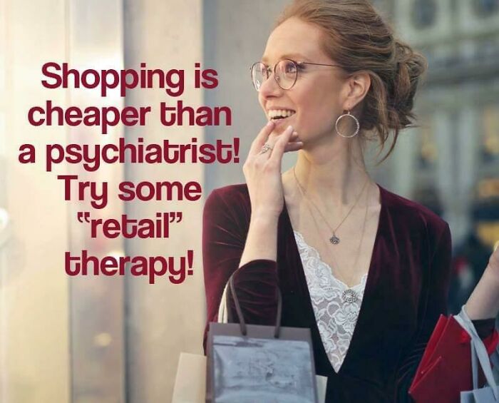 Woman in glasses smiling, shopping bags in hand, illustrating retail therapy in a horrid and sad world.