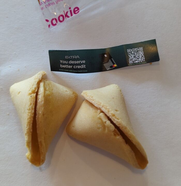 Two fortune cookies with a message saying You deserve better credit, a commentary on the sad world of finance.
