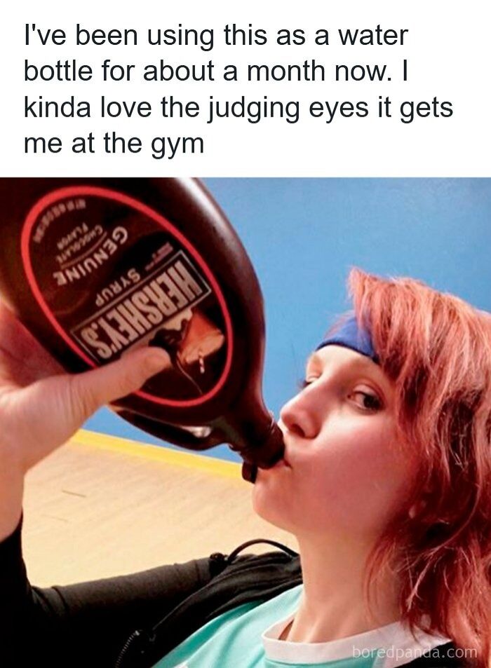 A woman drinking Hershey's chocolate syrup from the bottle, a funny meme to deal with your hard day.