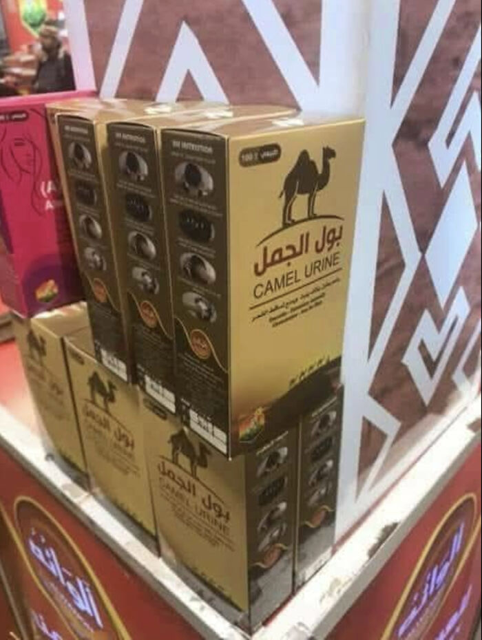 A truly bizarre product labeled camel urine on a shelf, making shoppers hallucinate its strange purpose.