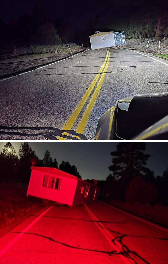 A mobile home strangely positioned on a road at night, creating a truly bizarre and surreal scene.