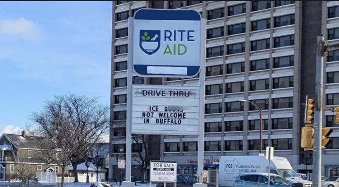 A chaotic good post displaying a Rite Aid sign with a humorous message about ice cream, inspiring you to be the hero.