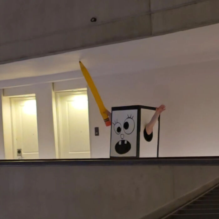 A person in a cartoon-like box costume, a creative proof of finding the right man for fun.