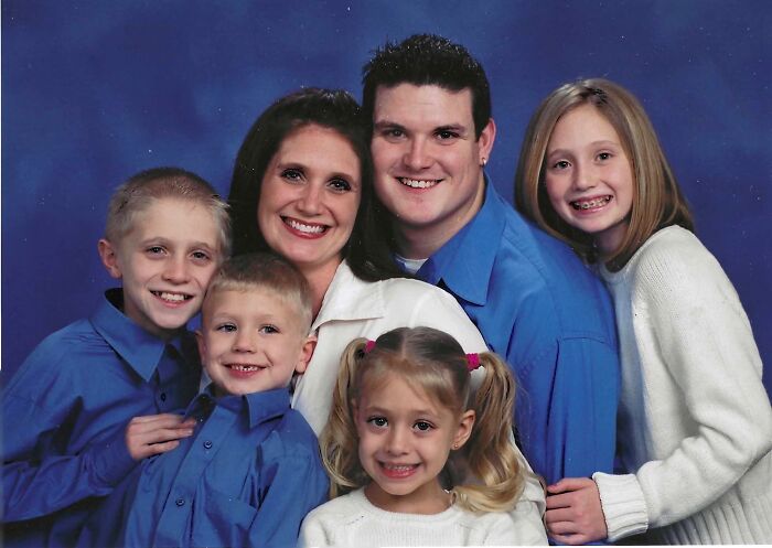 A family posing for a portrait, showing the sweet proof they found the right man.