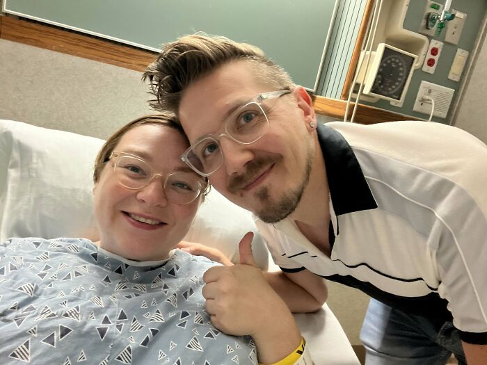 A happy couple in a hospital room, with the woman giving a thumbs-up. Sweetest proof of finding the right man.