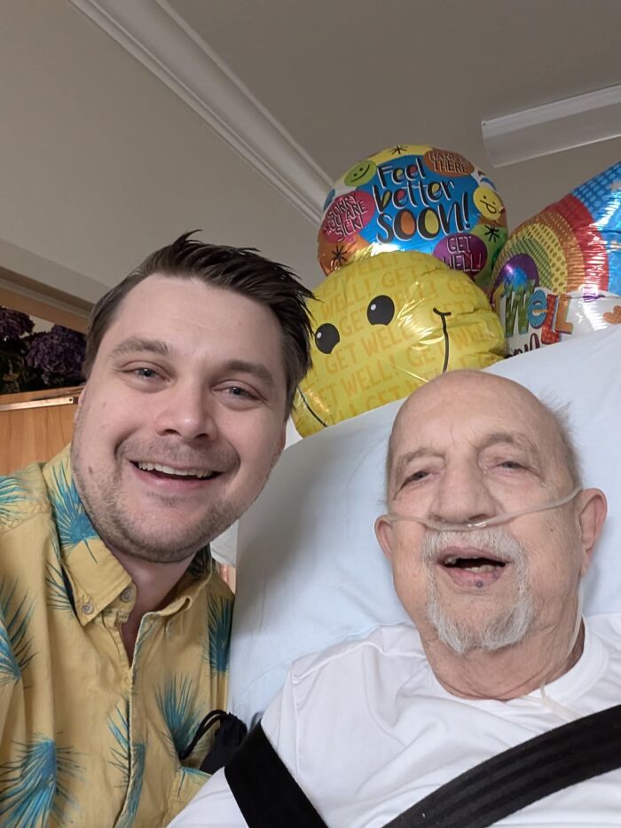 A man and an older man smiling at the camera, surrounded by balloons, sweet proof of finding the right man.