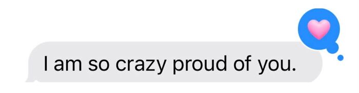 A text message bubble with the words I am so crazy proud of you and a pink heart, indicating sweet proof.