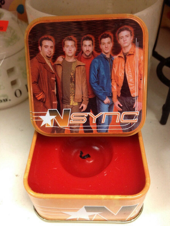An NSYNC themed candle holder, among other unhinged secondhand finds.