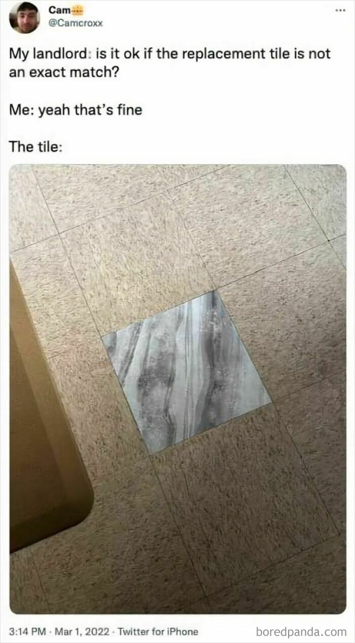 A mismatched replacement tile in the middle of a floor, a humorous example of questionable home improvement.