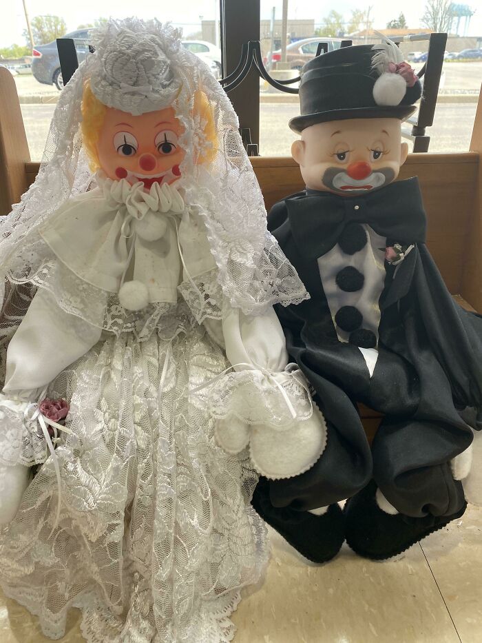 Unhinged secondhand finds: A creepy clown bride and groom doll set.