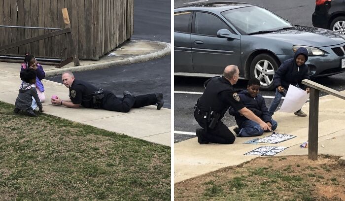 A police officer on the ground playing with two young children, an internet hilarious photo.