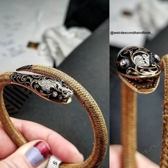 Detailed close-up of a snake-shaped secondhand bracelet with intricate black and gold enamel patterns and clear stones.