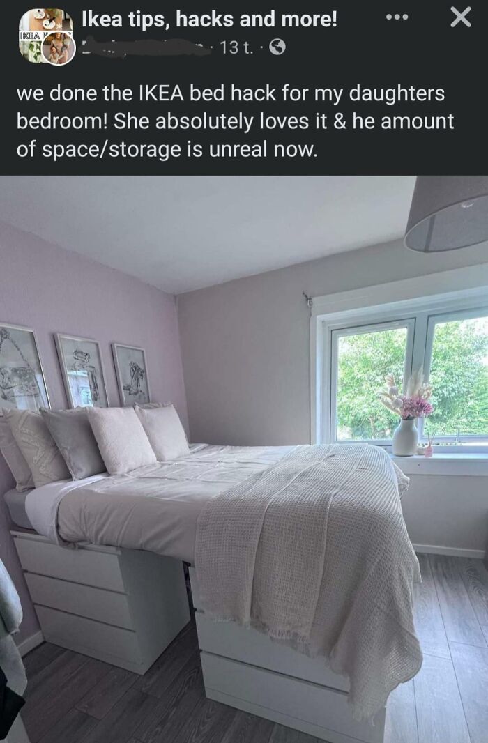 A white bed with storage drawers underneath, an IKEA bed hack that is a successful home improvement project.