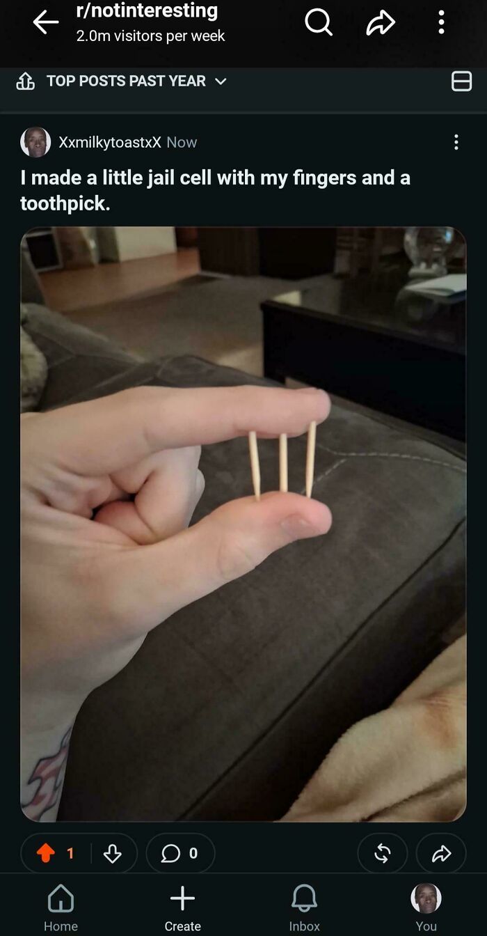 A hand holds three toothpicks to form a tiny jail cell, a visual example of online lies.