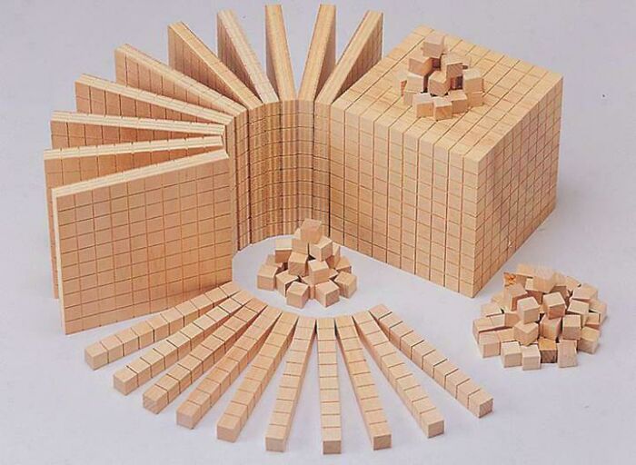 Wooden base ten blocks, a common classroom item evoking nostalgic Aussie memories of school.