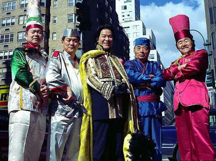 Five men in colorful, traditional Asian clothing, a nostalgic Aussie memory.