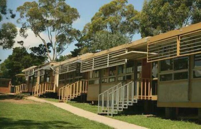 Row of low-rise buildings with many windows, representing nostalgic Aussie memories.