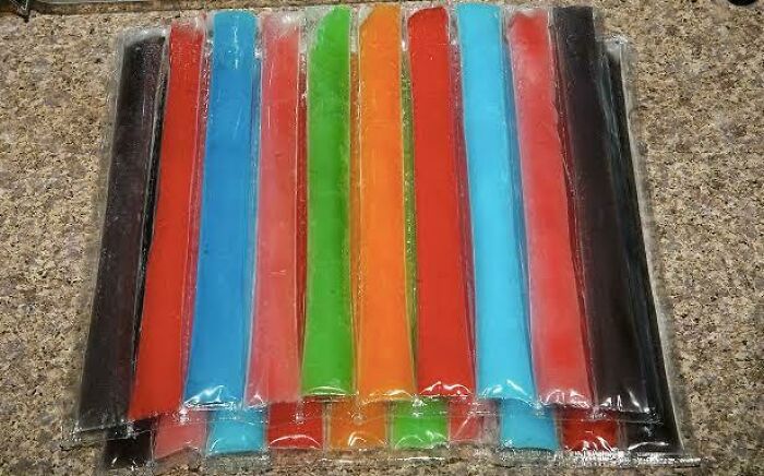 Colorful ice pops in a clear plastic package, evoking nostalgic Aussie memories.