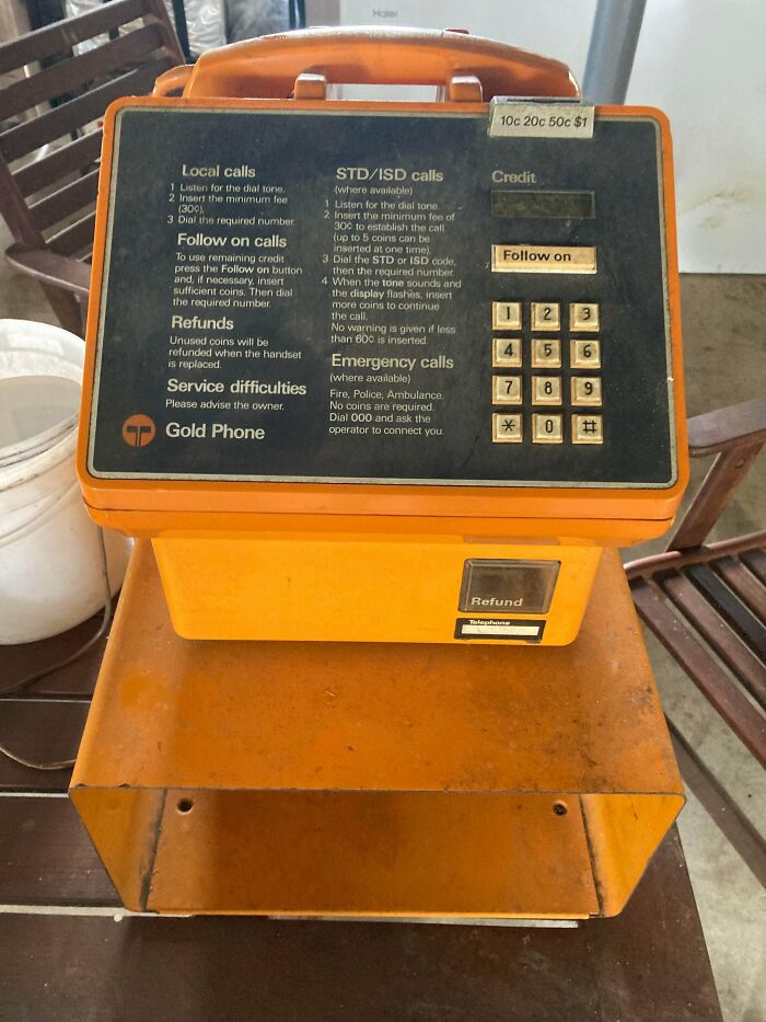 An old orange Gold Phone payphone, a familiar sight from nostalgic Aussie memories.