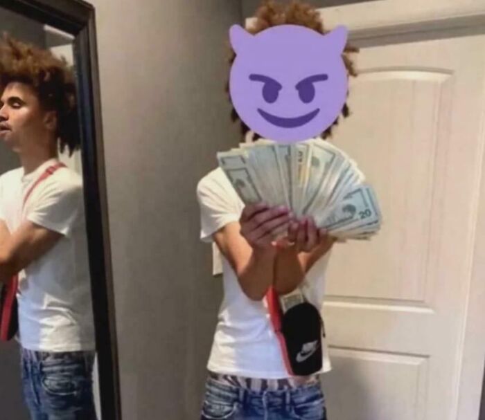 A young person holding a fan of money with a devil emoji over their face, a visual representation of online lies.