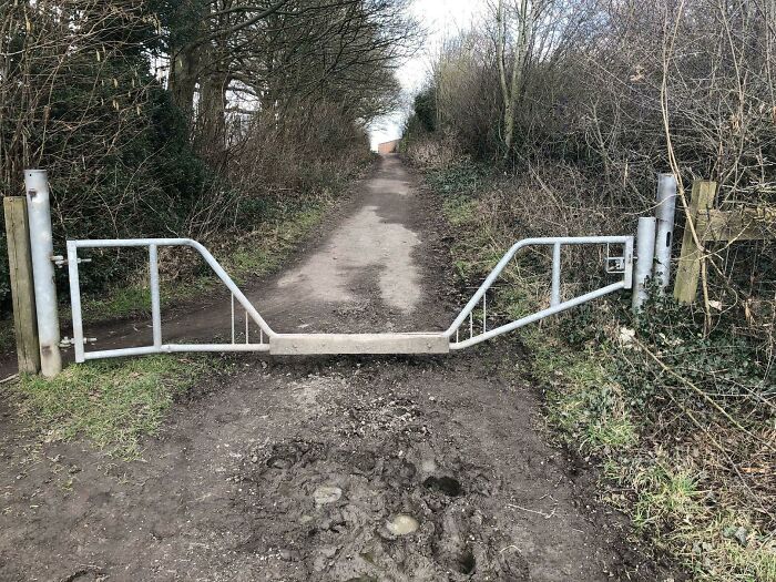 A cleverly designed metal gate for trails, providing easy access while blocking larger vehicles, an example of practical product designs.