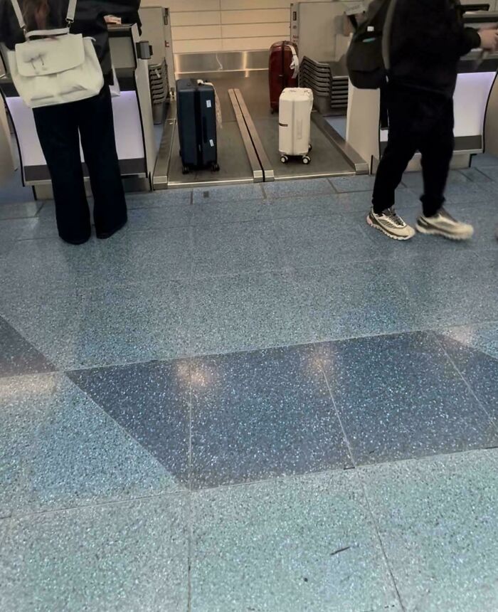 Travelers with luggage at an airport check-in counter, demonstrating practical product designs for efficient baggage handling.
