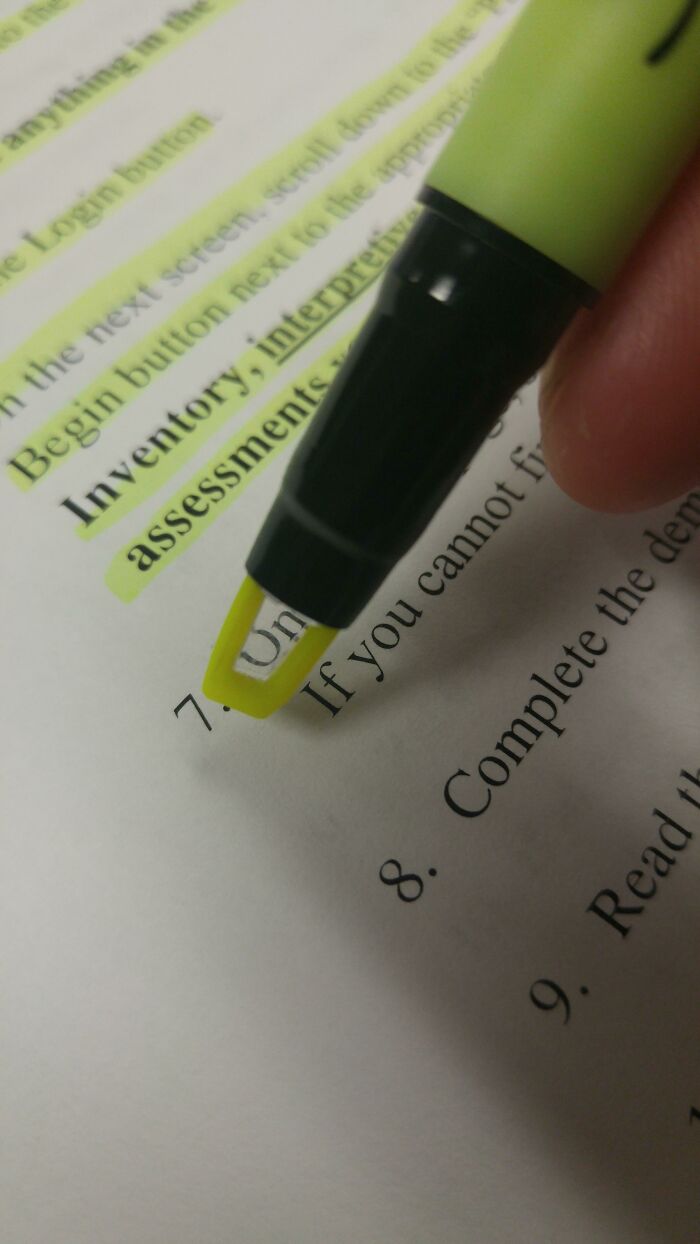 A highlighter being used to underline text on a document, illustrating a practical product design.