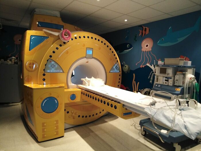 A vibrant yellow submarine-themed MRI machine, a brilliant product design for children.
