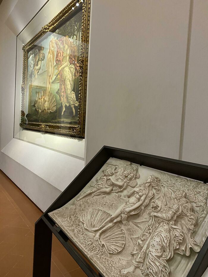 Art display showing a textured relief next to Botticelli's painting, a practical product design for accessibility.