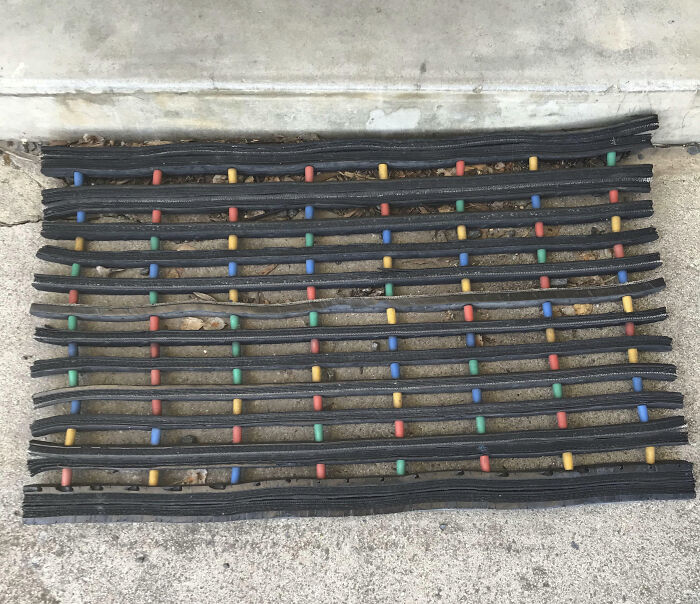 A rubber doormat with colorful pegs on concrete, a nostalgic Aussie memory.