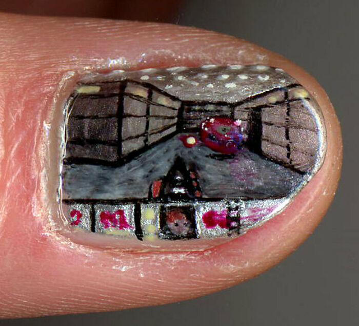 Detailed Doom video game scene painted on a fingernail, an unhinged image of intricate nail art.
