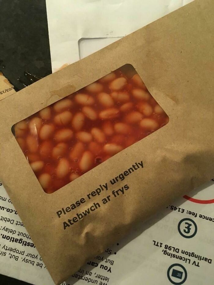 Unhinged images: An envelope with a window revealing baked beans inside, displaying a reply urgently message.