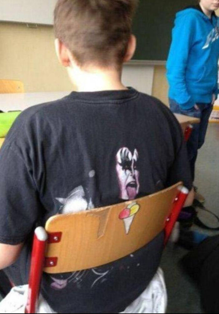 Student in black KISS t-shirt with ice cream cone on chair, amazing times something synced just right.