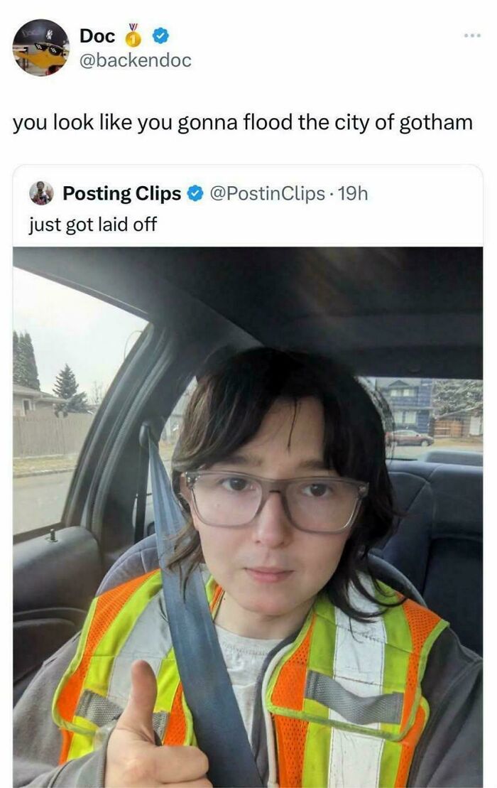 A funny comment on a tweet. A person wearing a safety vest gives a thumbs up. The comment section is funnier.