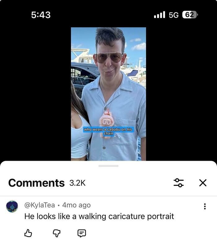 A screenshot of a video featuring a man with a Labubu chain and a comment that was funnier than the actual post.