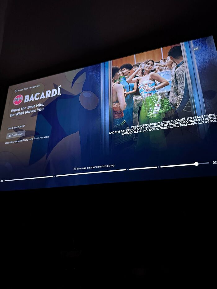 A television screen displaying a Bacardi advertisement, illustrating products and services getting worse while more expensive.
