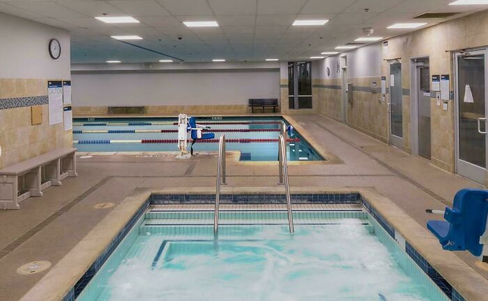 An indoor swimming pool and hot tub area, reflecting products and services getting worse and more expensive.