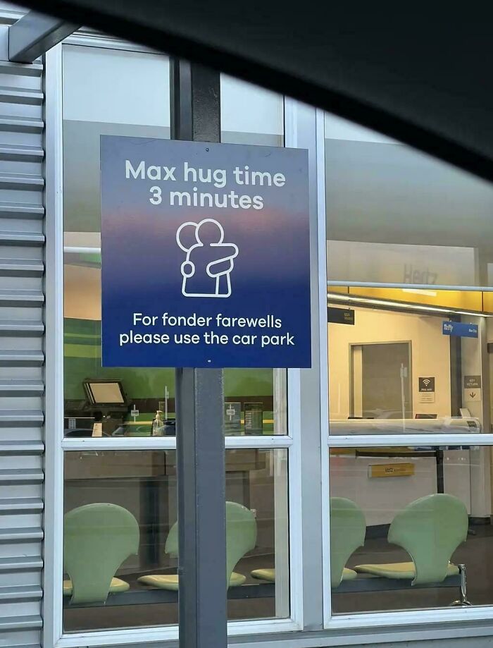 A chaotic sign limiting hug time to 3 minutes, telling people to use the car park for fonder farewells.