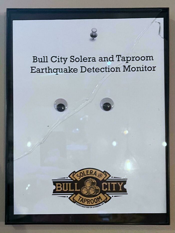 A chaotic sign with googly eyes for an earthquake detection monitor.