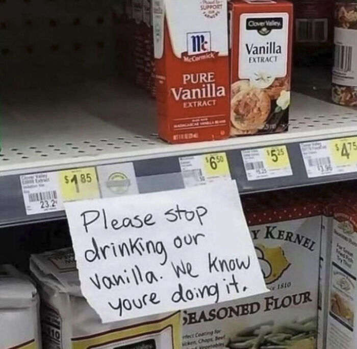 A chaotic sign spotted in the wild on a store shelf, instructing customers to Please stop drinking our vanilla.